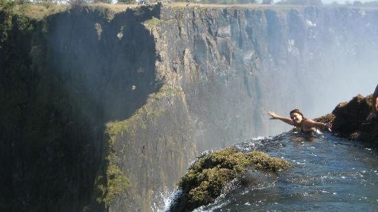 Tourists Daring to Swim the Devil Pool at the lip of Victoria Falls!