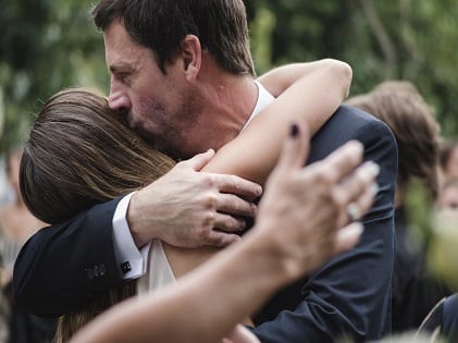 man-and-woman-hugging-while-man-kissing-woman-s-head