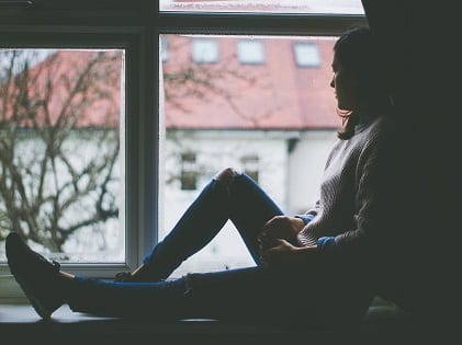 woman sitting by the window